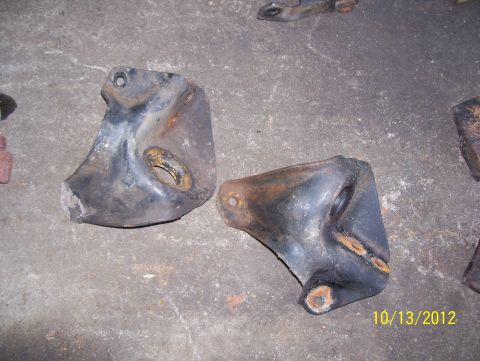 1990 Ford Bronco - These appear to be engine or suspension mounting brackets, showing signs of wear and rust.