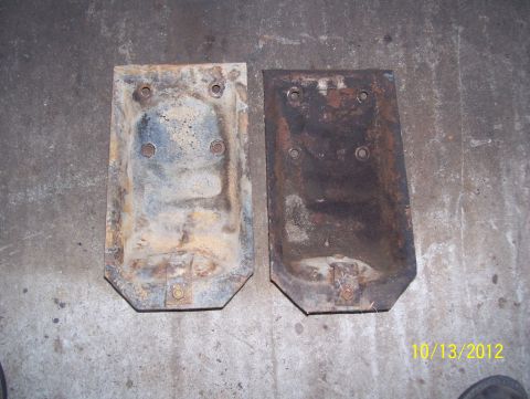 1990 Ford Bronco - Two rusty metal plates, possibly for a vehicle, are shown against a concrete background. The date 10/13/2012 is visible.