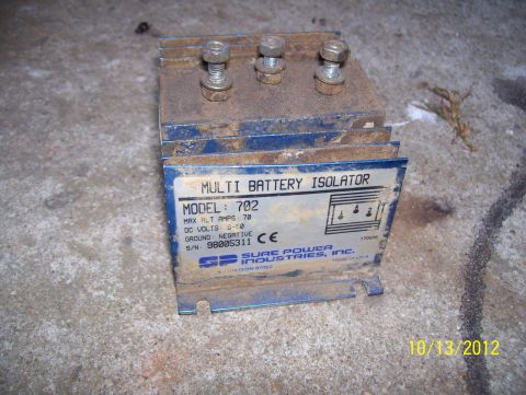 1990 Ford Bronco - This Sure Power Industries multi battery isolator, model 702, is shown on a concrete surface.