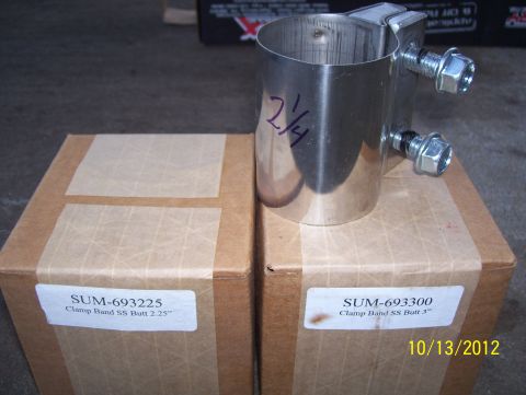 1990 Ford Bronco - Two exhaust clamps and their boxes are shown, one labeled 2.25" and the other 3".