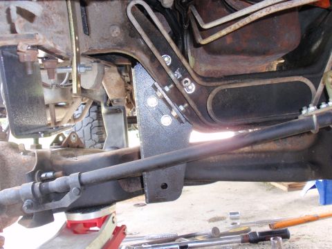 1995 Ford Bronco - Undercarriage view showing suspension modifications and frame components.