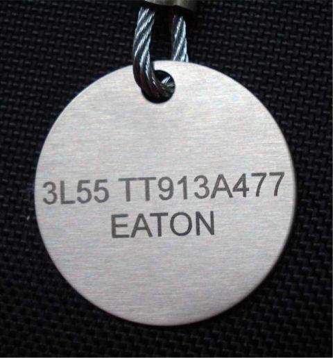 2008 Ford Crown Victoria - A metal tag with engraved identification numbers and the name EATON is shown.