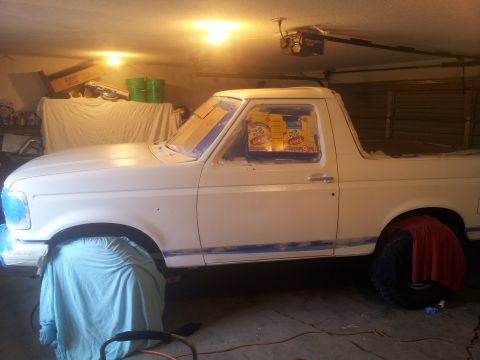 1996 Ford Bronco - This 1996 Ford Bronco is undergoing preparation for a new paint job in a garage setting.