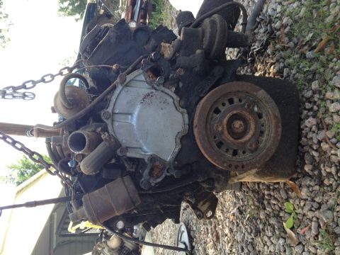1987 Ford Ranger - Engine part, likely from a truck, is shown suspended by chains in a "tear down" section.