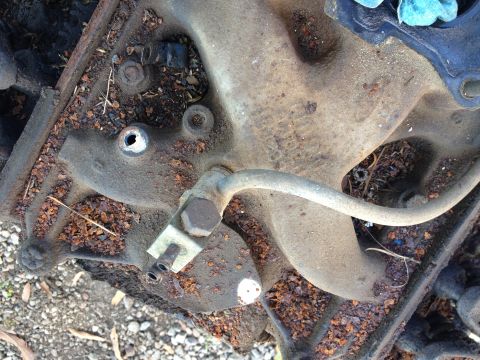 1987 Ford Ranger - This is a close-up view of a used engine intake manifold, covered in dirt and debris.