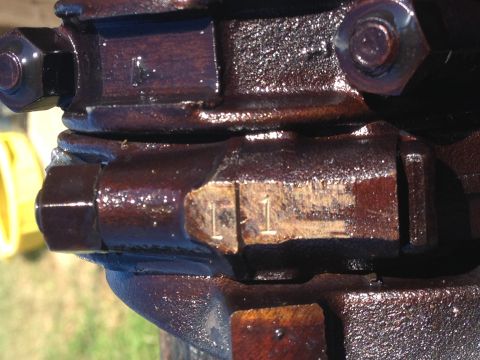 1987 Ford Ranger - A close-up view of a metal part shows stamped numbers, but no vehicle identification is visible.