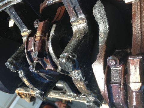1987 Ford Ranger - Close-up view of engine crankshaft and connecting rod assembly, showing wear and oil.