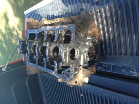 1987 Ford Ranger - Engine block removed from a vehicle, covered in grime and rust.