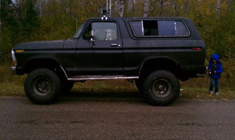 1979 Ford Bronco - Side view of a black 1978 Ford Bronco, lifted and equipped for off-road use.