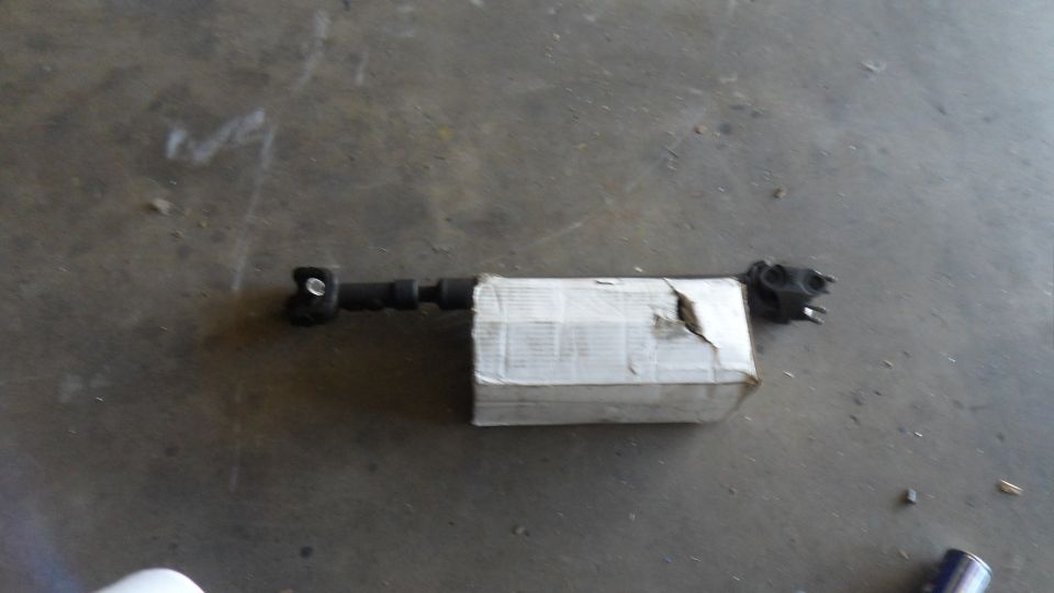 driveshaft with a cardboard box around the middle section