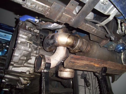1995 Ford Probe - Underside view of turbocharger and exhaust system components, possibly during maintenance.