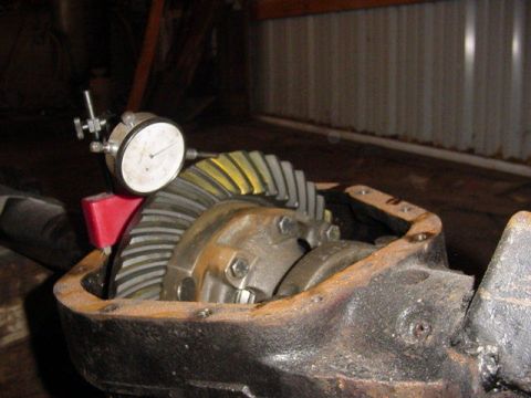 1992 Ford Bronco - Close-up of a differential gear assembly with a dial indicator attached, measuring backlash.