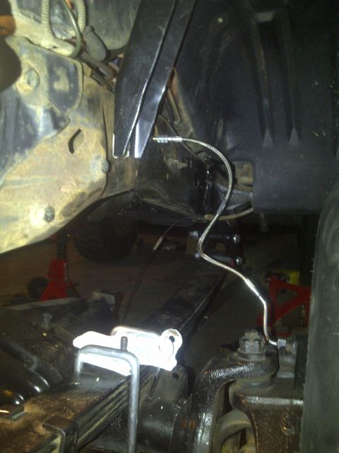 1995 Ford Bronco - Undercarriage view showing suspension components and frame structure.