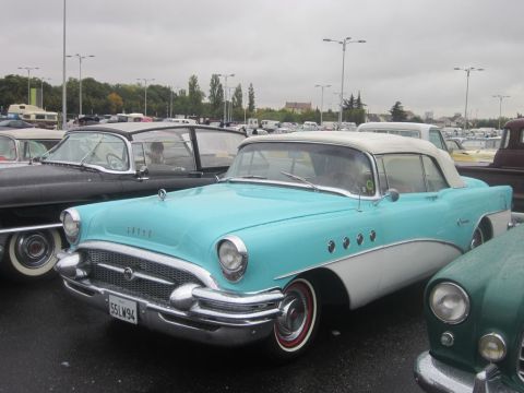 1991 Ford LTD Crown Victoria - Turquoise and white 1955 Buick Special Convertible with chrome accents and whitewall tires.