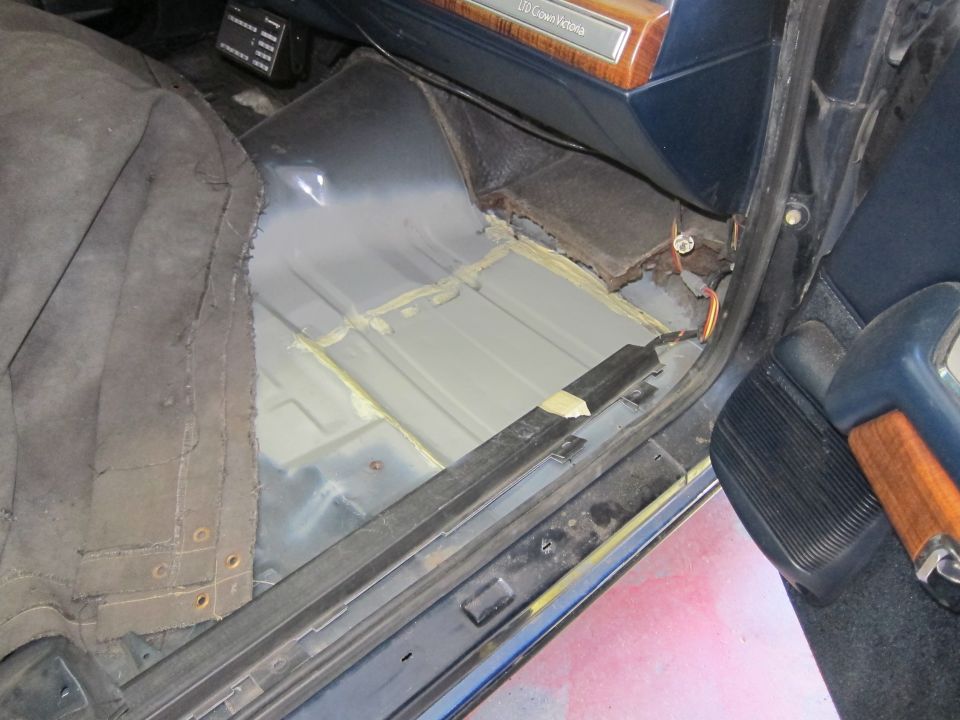 Interior view of a 1991 Ford Crown Victoria LTD showing the floor and dashboard trim