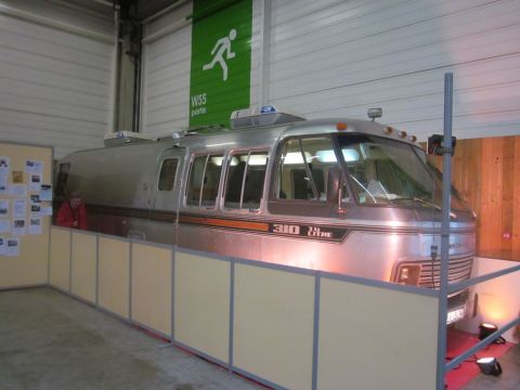 1991 Ford LTD Crown Victoria - This Airstream motorhome is displayed behind a temporary barrier at an event.