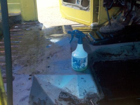 1978 Ford Bronco - Interior view of a 1978 Ford Bronco, with a spray bottle on the floor.