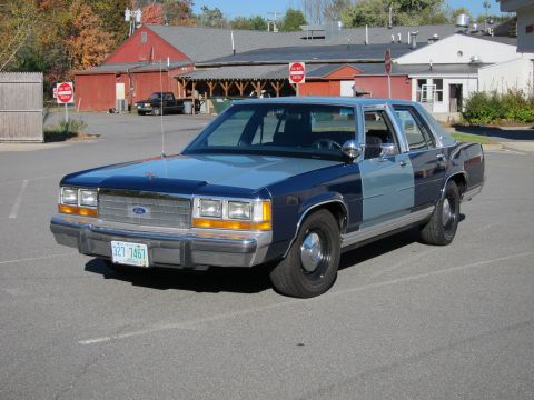 1991 Ford LTD Crown Victoria - This 1991 Ford Crown Victoria LTD is seen from a three-quarter front angle in a parking lot.