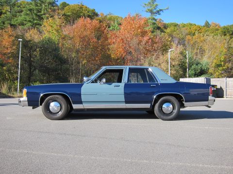 1991 Ford LTD Crown Victoria - This 1991 Ford Crown Victoria LTD is seen from the side, a two-tone blue paint scheme.