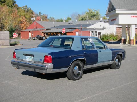 1991 Ford LTD Crown Victoria - This 1991 Ford Crown Victoria LTD is seen in a parking lot with a two-tone blue and gray paint scheme.