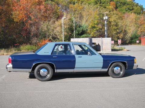 1991 Ford LTD Crown Victoria - This 1991 Ford Crown Victoria LTD sedan is seen from the side, a distinctive two-tone paint scheme.