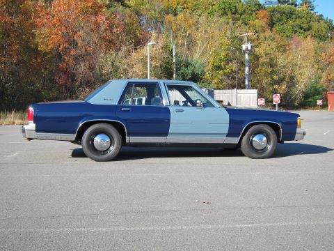 1991 Ford LTD Crown Victoria - This sedan has a two-tone paint job with a distinct color change halfway down the body.