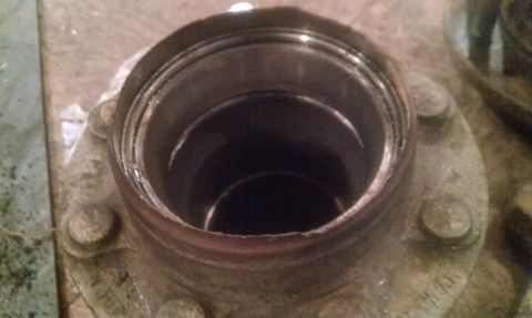 1995 Ford Bronco - This image shows a wheel hub assembly with significant damage and wear, suggesting it may need replacement.