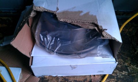 1995 Ford Bronco - New brake rotor in its packaging, part number 112191 visible on the box.