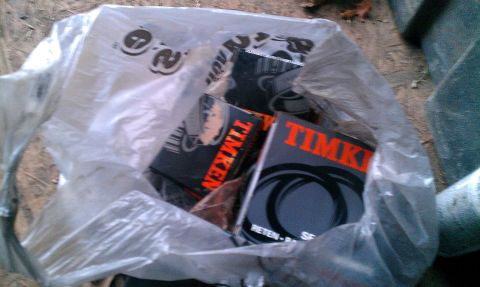 1995 Ford Bronco - Several boxes of Timken brand automotive parts are visible inside a clear plastic bag.