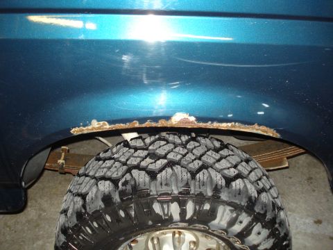 1994 Ford Bronco - Rust is visible on the fender lip above the rear tire of this 1994 Ford Bronco.