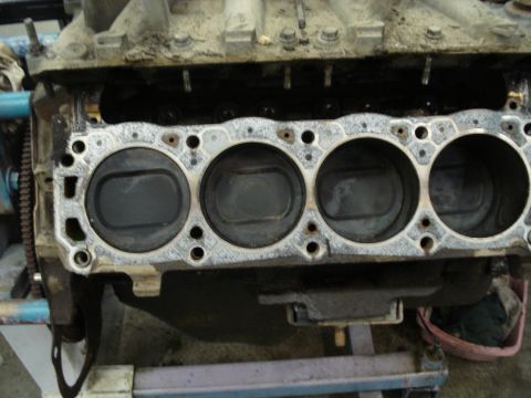 1994 Ford Bronco - Close-up view of an engine block's cylinders and pistons, likely during a rebuild process.
