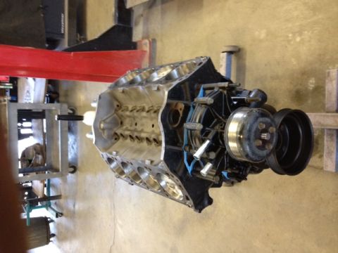 1994 Ford Bronco - This V8 engine block is shown with its water pump and pulleys, likely before installation or during a rebuild.