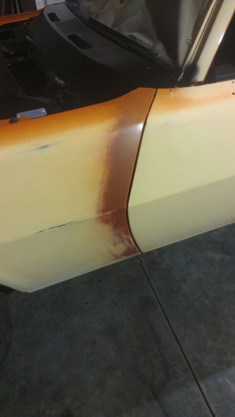 1973 Chevrolet Camaro - A car's side panel shows primer and rust, indicating it is undergoing restoration.
