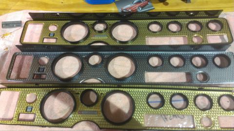 1973 Chevrolet Camaro - Three dashboard instrument panels are laid out, each a diamond-patterned bezel and various circular gauge openings.