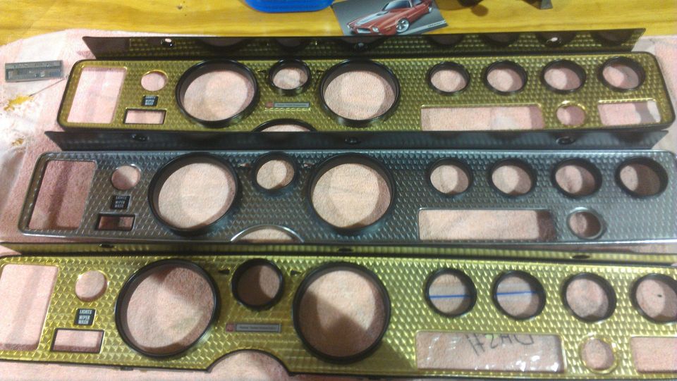 Three dashboard instrument panels with diamond-patterned bezels and multiple gauge openings
