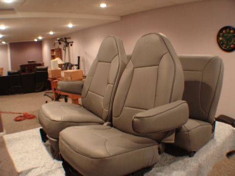 1992 Ford F-250 - Interior vehicle seats are shown in a room with a gym setup in the background.