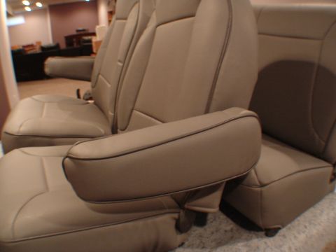 1992 Ford F-250 - Tan leather bucket seats with armrests are shown in detail.