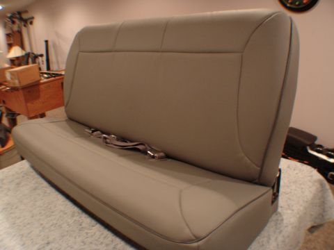 1992 Ford F-250 - Bench seat with seatbelts, light brown upholstery, indoors.