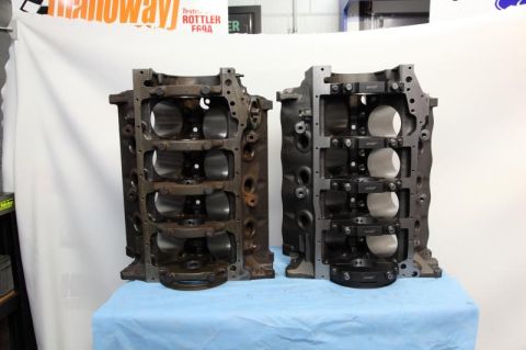 1972 Ford Ranchero - Two engine blocks are displayed, one showing signs of rust and the other appearing recently machined.
