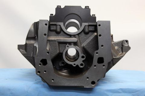 1972 Ford Ranchero - A black engine block is shown from the front, resting on a blue cloth surface.