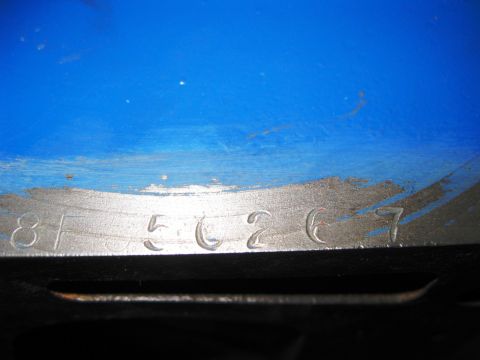 1968 Mercury Cougar - Close-up of an engine part casting showing stamped identification numbers.