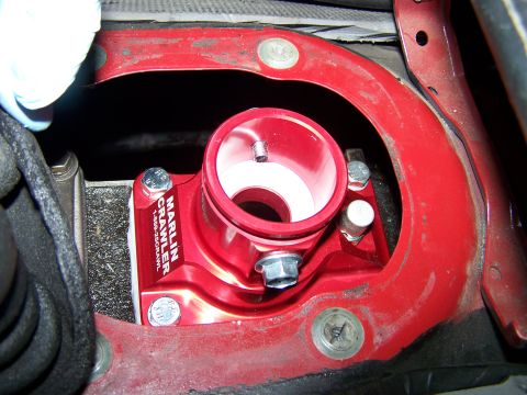 1988 Suzuki Samurai - A red Marlin Crawler part is installed in a vehicle's red metal housing.