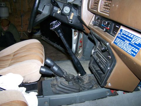 1988 Suzuki Samurai - The interior of a 1988 Suzuki Samurai shows its dual gear shifters and a caution sticker on the dash.