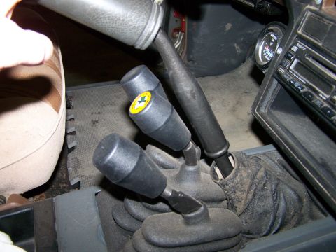 1988 Suzuki Samurai - Interior view of a 1988 Suzuki Samurai, highlighting the gear shifters and dashboard components.