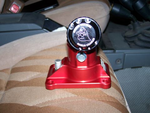 1988 Suzuki Samurai - Close-up of a red Marlin Crawler transfer case shifter knob inside a vehicle.