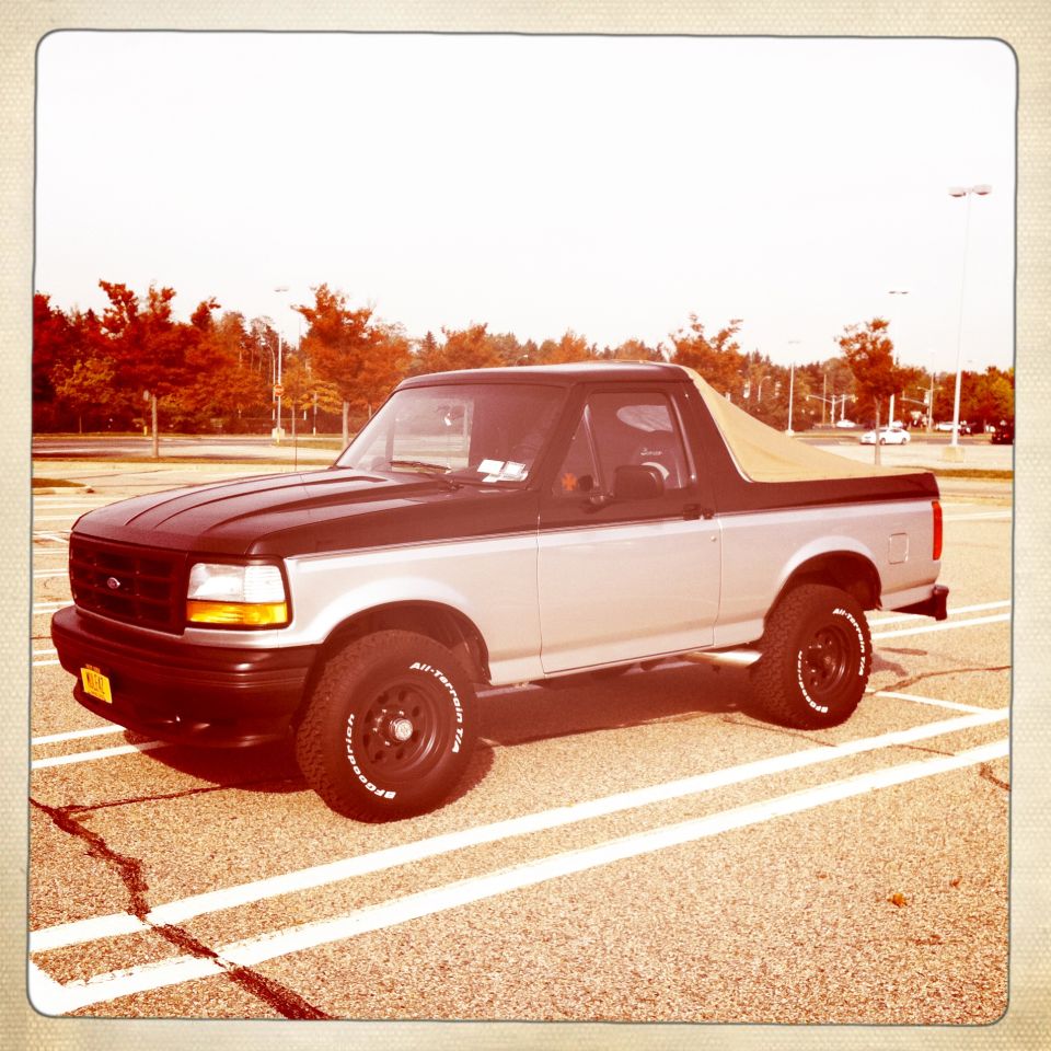 1992 Ford Bronco two-tone black and silver with tan soft top
