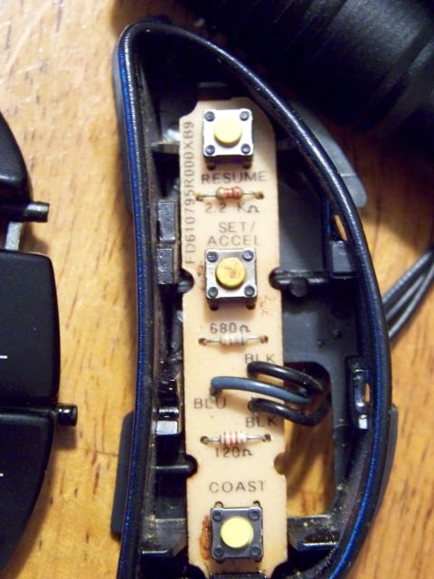 1999 Mercury Grand Marquis - Close-up of a cruise control switch circuit board showing electronic components and labels.