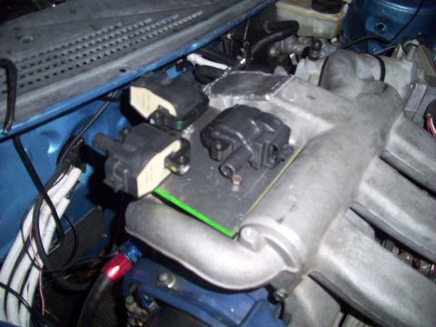 1995 Ford Probe - Engine bay with ignition coils and intake manifold visible.