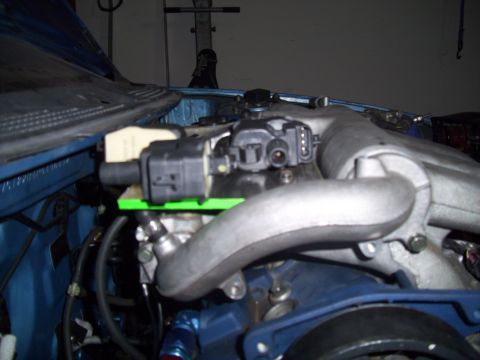 1995 Ford Probe - The photo shows a close-up view of engine components, specifically the intake manifold and associated sensors.