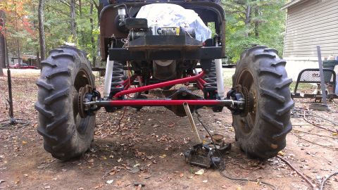 1978 Ford Bronco - This heavily modified off-road vehicle features oversized tractor tires and a custom suspension system.